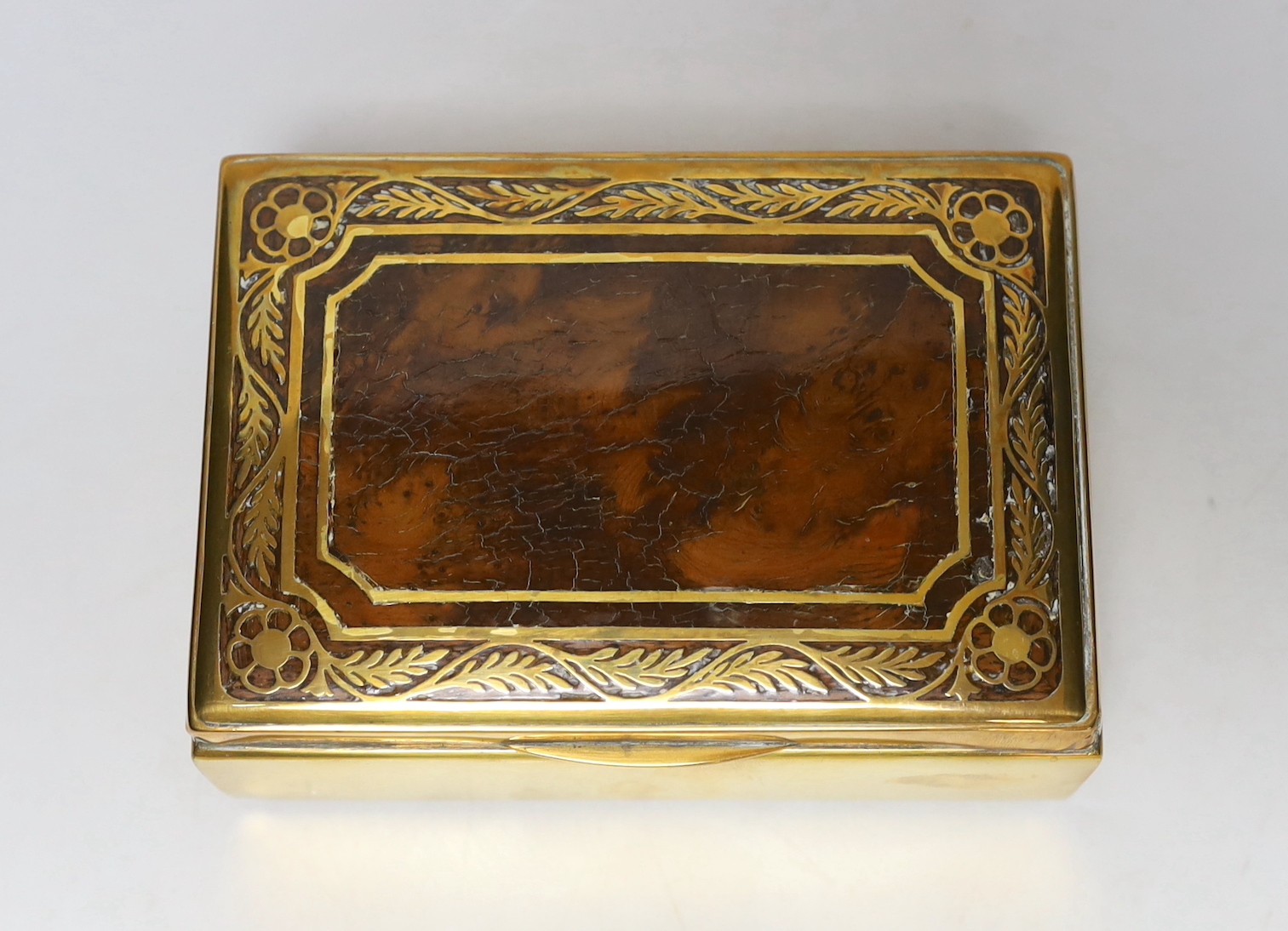 A burr oak topped brasswork cigarette box, 14ms wide x10cms deep